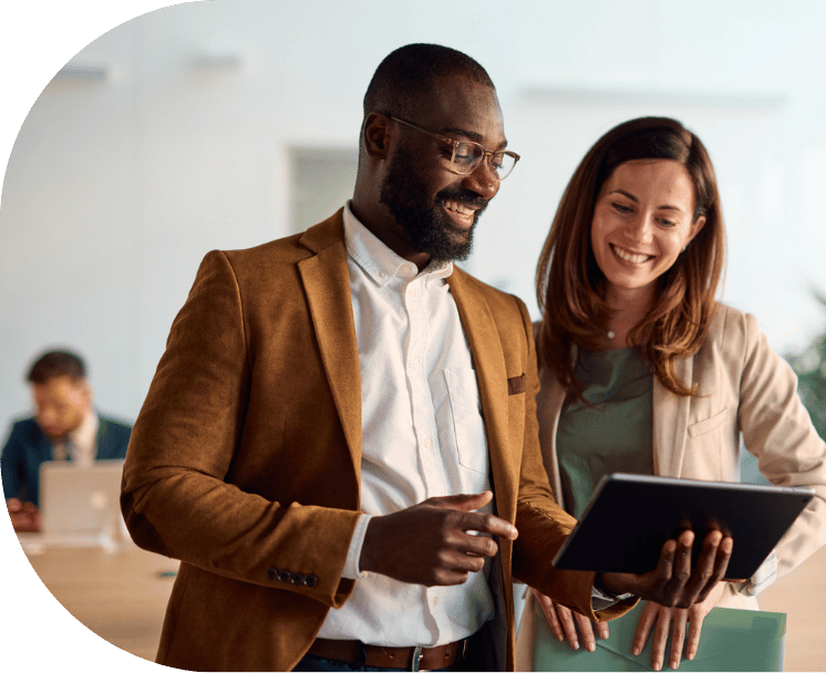 om-website-services-dx-pillar-two-coworkers-tablet